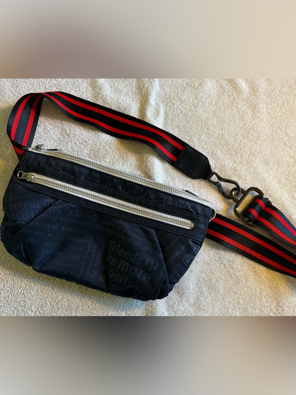 lululemon athletica navy belt bag with red/navy striped strap